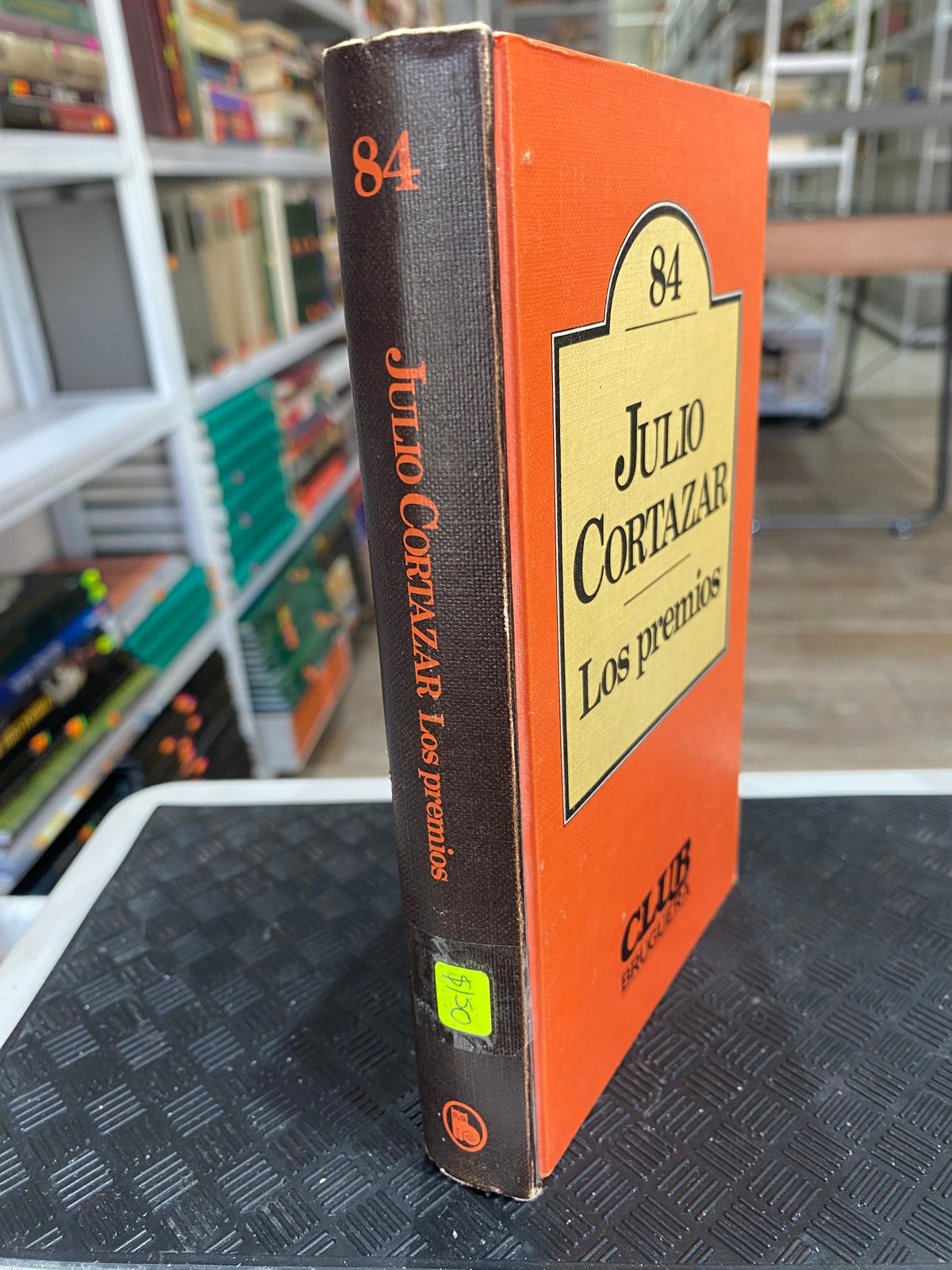 LOS PREMIOS POR JULIO CORTAZAR USADO NOVELA JUAREZ 515 BUEN ESTADO PASTA DURA EDICION ESPAÑOL EDITORIAL BRUGERA